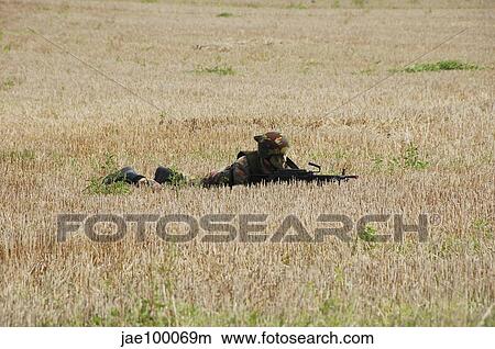 Picture - Belgian paratroopers on guard in the fields.. Fotosearch