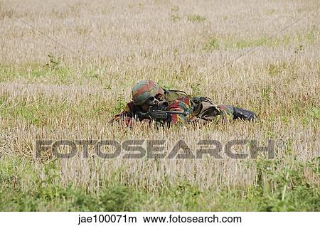 Belgian paratroopers on guard in the fields. View Large Photo Image Picture - Belgian paratroopers on guard in the fields.. Fotosearch