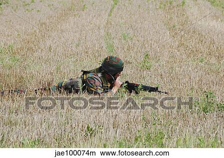 Picture - Belgian paratroopers on guard in the fields.. Fotosearch