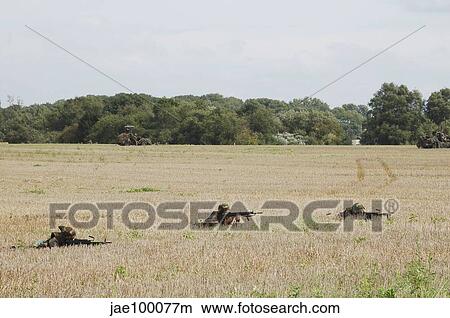 Belgian paratroopers on guard in the fields. View Large Photo Image Picture - Belgian paratroopers on guard in the fields.. Fotosearch