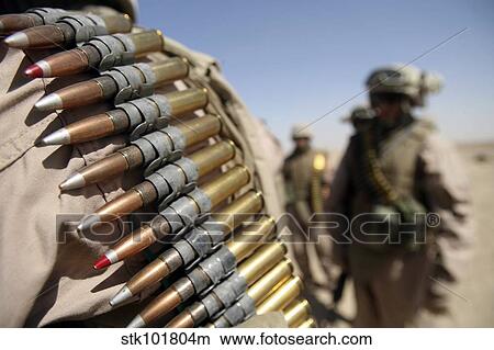 Belts of. 50-caliber ammunition hang from the shoulders of Marines. View Large Photo Image Picture - Belts of. 50-caliber ammunition hang from the shoulders of Marines.. Fotosearch
