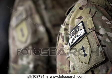 Big Red One patch on the uniform of a soldier assigned to the 1st Infantry Division. View Large Photo Image Picture - Big Red One patch on the uniform of a soldier assigned to the 1st Infantry Division.. Fotosearch