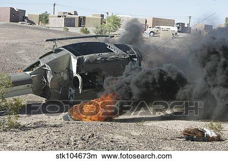 Picture - Black smoke rises to the air from a simulated wreckage of a downed UH-1N Huey.. Fotosearch