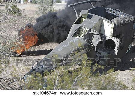Picture - Black smoke rises to the air from a simulated wreckage of a downed UH-1N Huey.. Fotosearch