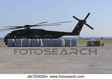 Bottled water is ready to be loaded onto a U. S. Navy MH-53E Sea Dragon. View Large Photo Image Picture - Bottled water is ready to be loaded onto a U. S. Navy MH-53E Sea Dragon.. Fotosearch