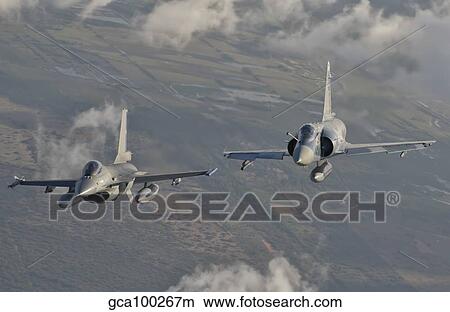 Brazilian Air Force Mirage 2000 and Chilean Air Force F-16 in flight over Brazil. View Large Photo Image Picture - Brazilian Air Force Mirage 2000 and Chilean Air Force F-16 in flight over Brazil.. Fotosearch