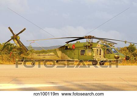 Brazilian Air Force UH-60 helicopter at sunset. View Large Photo Image Picture - Brazilian Air Force UH-60 helicopter at sunset.. Fotosearch