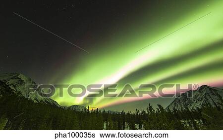 Bright aurora borealis, Annie Lake, Yukon, Canada. View Large Photo Image Stock Photograph - Bright aurora borealis, Annie Lake, Yukon, Canada.. Fotosearch