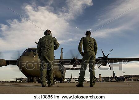 Picture - British Royal Air Force C-130J engineers conduct start up procedures.. Fotosearch
