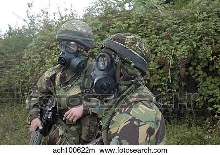 Picture - British soldiers in full NBC protection gear and a S6 respirator.. Fotosearch