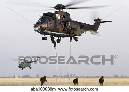 Bulgarian special forces fast-roping from a Eurocopter AS532 Cougar. View Large Photo Image Picture - Bulgarian special forces fast-roping from a Eurocopter AS532 Cougar.. Fotosearch