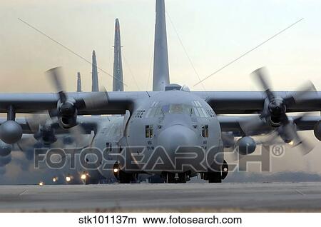 C-130 Hercules aircraft taxi out for a mission during a six-ship sortie. View Large Photo Image Picture - C-130 Hercules aircraft taxi out for a mission during a six-ship sortie.. Fotosearch