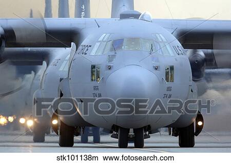 Picture - C-130 Hercules aircraft taxi out for a mission during a six-ship sortie.. Fotosearch