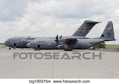 C-130J Super Hercules with a C-17 Globemaster. View Large Photo Image Picture - C-130J Super Hercules with a C-17 Globemaster.. Fotosearch