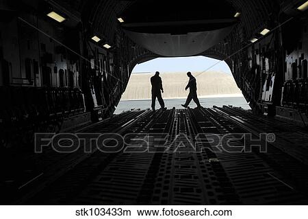 C-17A Globemaster III loadmasters go through prefight checks on the ramp. View Large Photo Image Picture - C-17A Globemaster III loadmasters go through prefight checks on the ramp.. Fotosearch
