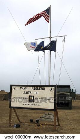 Camp Peguero sign and central flag pole for the Navy, Army and Marine forces camp site. View Large Photo Image Picture - Camp Peguero sign and central flag pole for the Navy, Army and Marine forces camp site.. Fotosearch