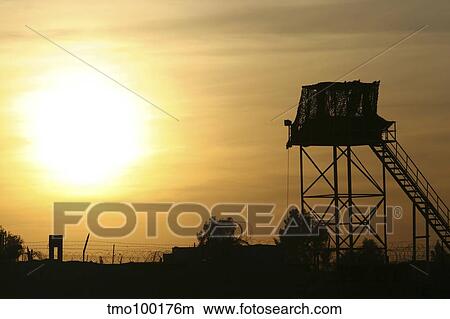 Camp Warhorse guard tower at sunset. View Large Photo Image Picture - Camp Warhorse guard tower at sunset.. Fotosearch