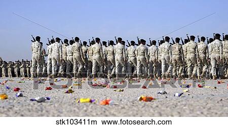 Candy covers the parade grounds during a pass in review at an Iraqi Air Force officer graduation ceremony. View Large Photo Image Picture - Candy covers the parade grounds during a pass in review at an Iraqi Air Force officer graduation ceremony.. Fotosearch