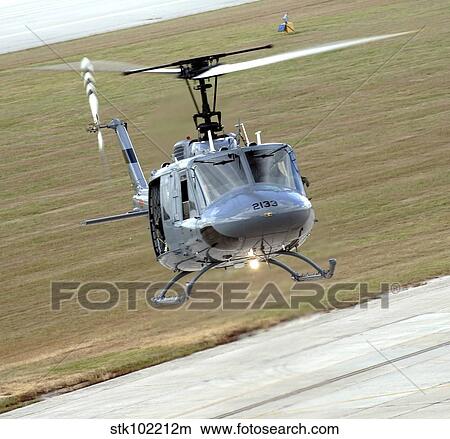 Captain pilots the TH-1H trainer helicopter with instructor pilot. View Large Photo Image Picture - Captain pilots the TH-1H trainer helicopter with instructor pilot.. Fotosearch
