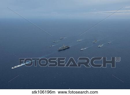 Carrier Strike Group formation of ships in the Bay of Bengal. View Large Photo Image Picture - Carrier Strike Group formation of ships in the Bay of Bengal.. Fotosearch