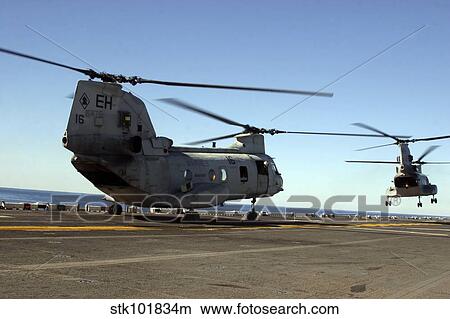 CH-46E Sea Knight helicopters practice vertical replenishments aboard USS Bataan. View Large Photo Image Picture - CH-46E Sea Knight helicopters practice vertical replenishments aboard USS Bataan.. Fotosearch