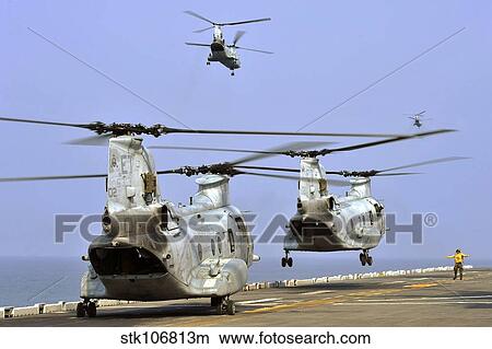 Picture - CH-46E Sea Knight helicopters take off from USS Bonhomme Richard.. Fotosearch