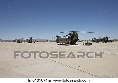 CH-47 Chinook helicopters parked on the tarmac. View Large Photo Image Picture - CH-47 Chinook helicopters parked on the tarmac.. Fotosearch