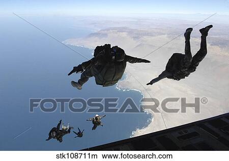 Chilean and U. S. pararescuemen jump near Iquique, Chile. View Large Photo Image Picture - Chilean and U. S. pararescuemen jump near Iquique, Chile.. Fotosearch