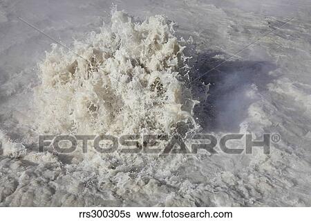 Stock Photograph - Churning Cauldron hot spring, Yellowstone National Park, Wyoming.. Fotosearch