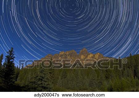 Circumpolar stars trails over Castle Mountain in Banff National Park, Canada. View Large Photo Image Stock Photograph - Circumpolar stars trails over Castle Mountain in Banff National Park, Canada.. Fotosearch