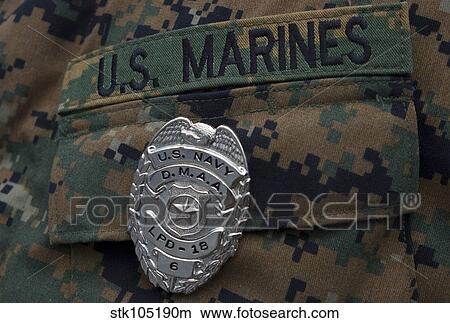 Close-up of a duty master-at-arms badge on the uniform of a U. S. Marine. View Large Photo Image Picture - Close-up of a duty master-at-arms badge on the uniform of a U. S. Marine.. Fotosearch