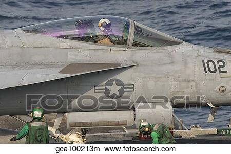 Close-up of a F/A-18 Super Hornet pilot inside aircraft. View Large Photo Image Picture - Close-up of a F/A-18 Super Hornet pilot inside aircraft.. Fotosearch