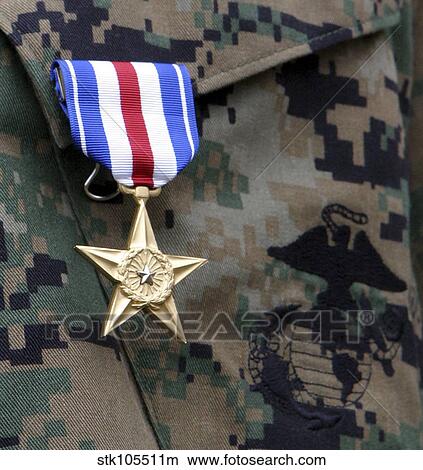 Close-up of a medal on the uniform of a soldier. View Large Photo Image Picture - Close-up of a medal on the uniform of a soldier.. Fotosearch