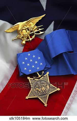 Close-up of the Medal of Honor award and American flag. View Large Photo Image Picture - Close-up of the Medal of Honor award and American flag.. Fotosearch