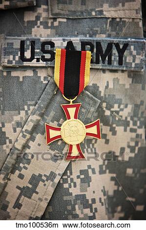 Close-up view of a German Gold Cross worn by a U. S. Army soldier. View Large Photo Image Picture - Close-up view of a German Gold Cross worn by a U. S. Army soldier.. Fotosearch