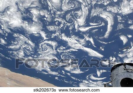 Cloud vortex streets off the coast of northwestern Africa. View Large Photo Image Stock Photograph - Cloud vortex streets off the coast of northwestern Africa.. Fotosearch