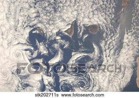 Cloud vortices in the area of the Canary Islands in the North Atlantic Ocean. View Large Photo Image Stock Photograph - Cloud vortices in the area of the Canary Islands in the North Atlantic Ocean.. Fotosearch