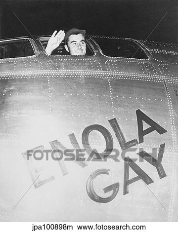 Colonel Paul Tibbets waving from the cockpit of the Enola Gay. View Large Photo Image Picture - Colonel Paul Tibbets waving from the cockpit of the Enola Gay.. Fotosearch