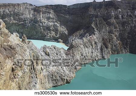 Stock Photograph - Colourful crater lakes of Kelimutu volcano, Flores Island, Indonesia.. Fotosearch