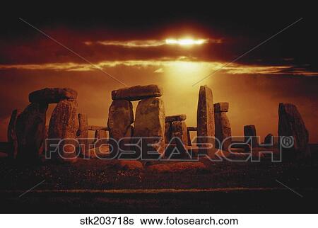 Composite of a sunset over Stonehenge, Wiltshire, England. View Large Photo Image Stock Photograph - Composite of a sunset over Stonehenge, Wiltshire, England.. Fotosearch