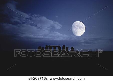 Stock Photograph - Composite of the moon over Stonehenge, Wiltshire, England. . Fotosearch