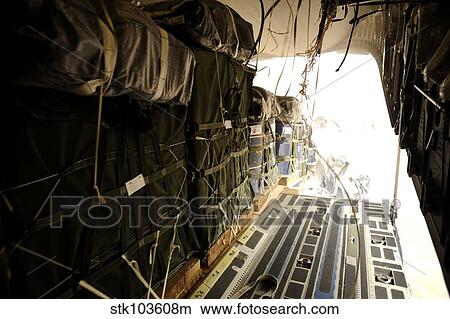Container delivery system bundles drop out of a C-17 Globemaster III over a drop zone in Afghanistan. View Large Photo Image Picture - Container delivery system bundles drop out of a C-17 Globemaster III over a drop zone in Afghanistan.. Fotosearch
