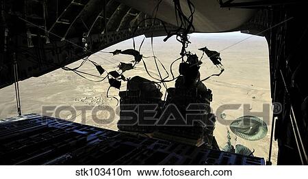 Container Delivery System bundles exit a C-17 Globemaster III during an airdrop mission. View Large Photo Image Picture - Container Delivery System bundles exit a C-17 Globemaster III during an airdrop mission.. Fotosearch