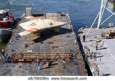 Contractors prepare to hoist the X-47B Unmanned Combat Air System. View Large Photo Image Picture - Contractors prepare to hoist the X-47B Unmanned Combat Air System.. Fotosearch
