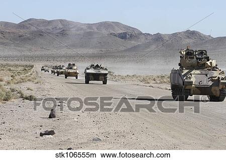 Convoy of military vehicles traveling in Fort Irwin, California. View Large Photo Image Picture - Convoy of military vehicles traveling in Fort Irwin, California.. Fotosearch