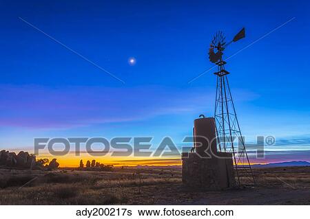 Crescent moon beside Mars and above Venus, framed by a windmill, New Mexico. View Large Photo Image Stock Photograph - Crescent moon beside Mars and above Venus, framed by a windmill, New Mexico.. Fotosearch