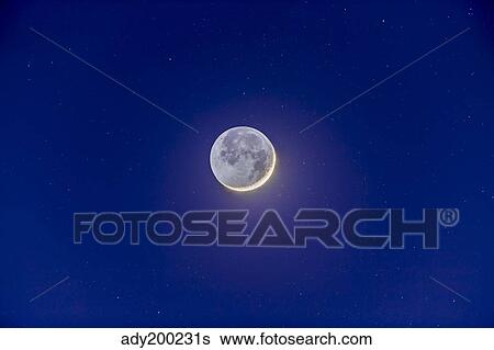 Crescent moon with earthshine. View Large Photo Image Stock Photograph - Crescent moon with earthshine.. Fotosearch