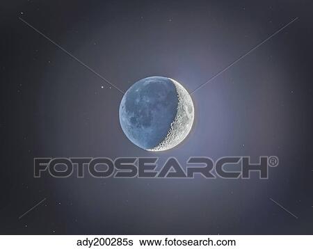 Stock Photograph - Crescent moon with earthshine.. Fotosearch