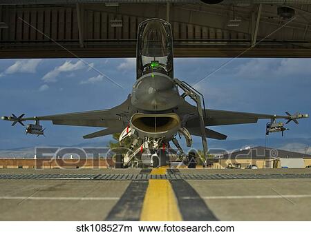 Crew members prepare an F-16 Fighting Falcon for a training sortie. View Large Photo Image Picture - Crew members prepare an F-16 Fighting Falcon for a training sortie.. Fotosearch