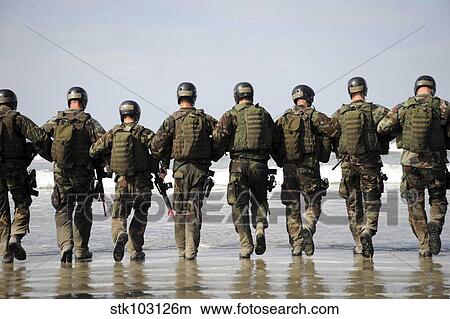 Crewman Qualification Training students hitting the surf before the start of medical training instruction. View Large Photo Image Picture - Crewman Qualification Training students hitting the surf before the start of medical training instruction.. Fotosearch